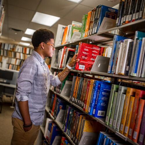 student in library